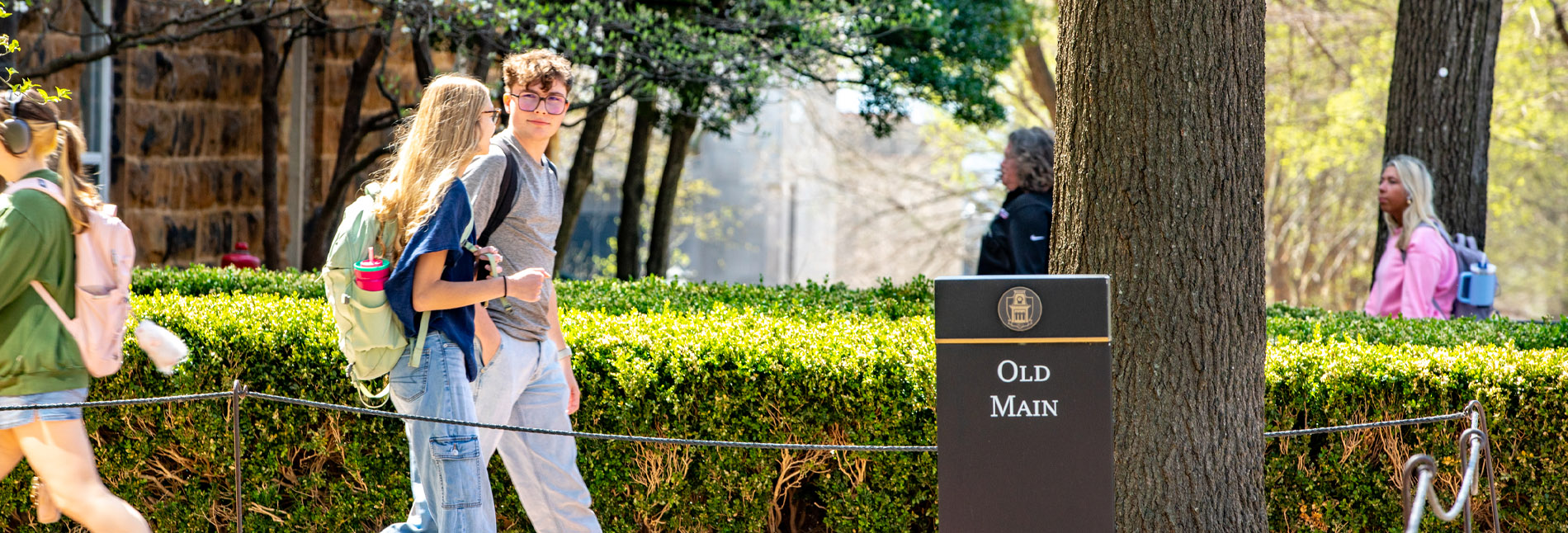 Students walking behind Old Main